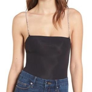 New black spandex body suit with rhinestone straps
